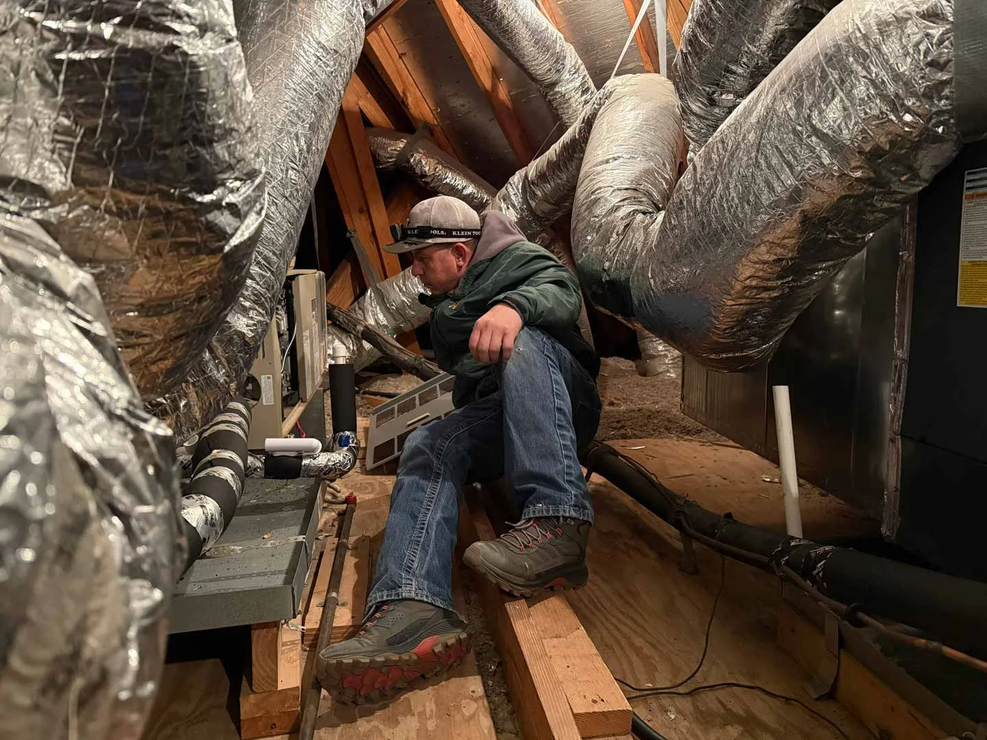 Technician repairing residential heating system in Houston TX