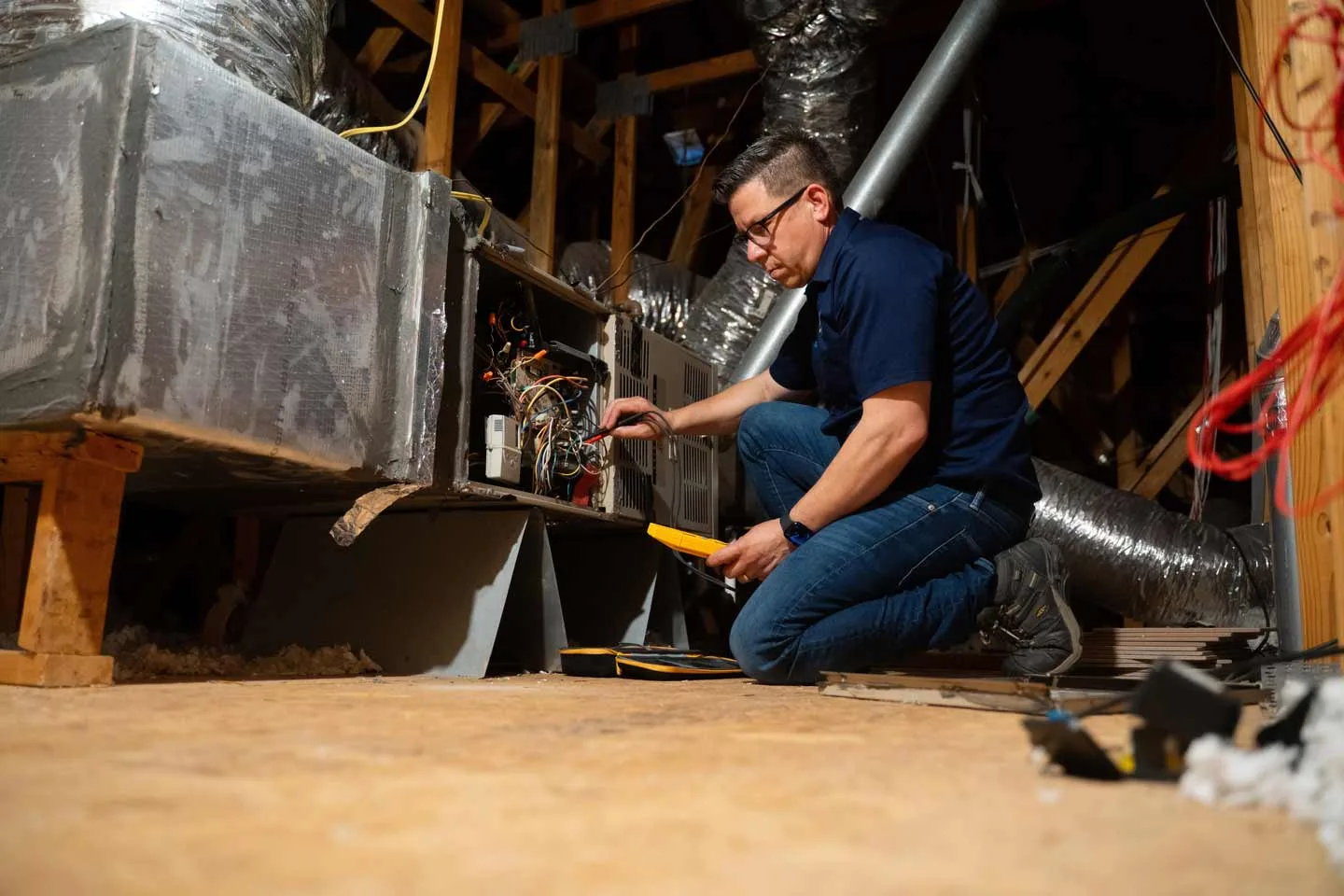 HVAC technician diagnosing and repairing system in Houston TX
